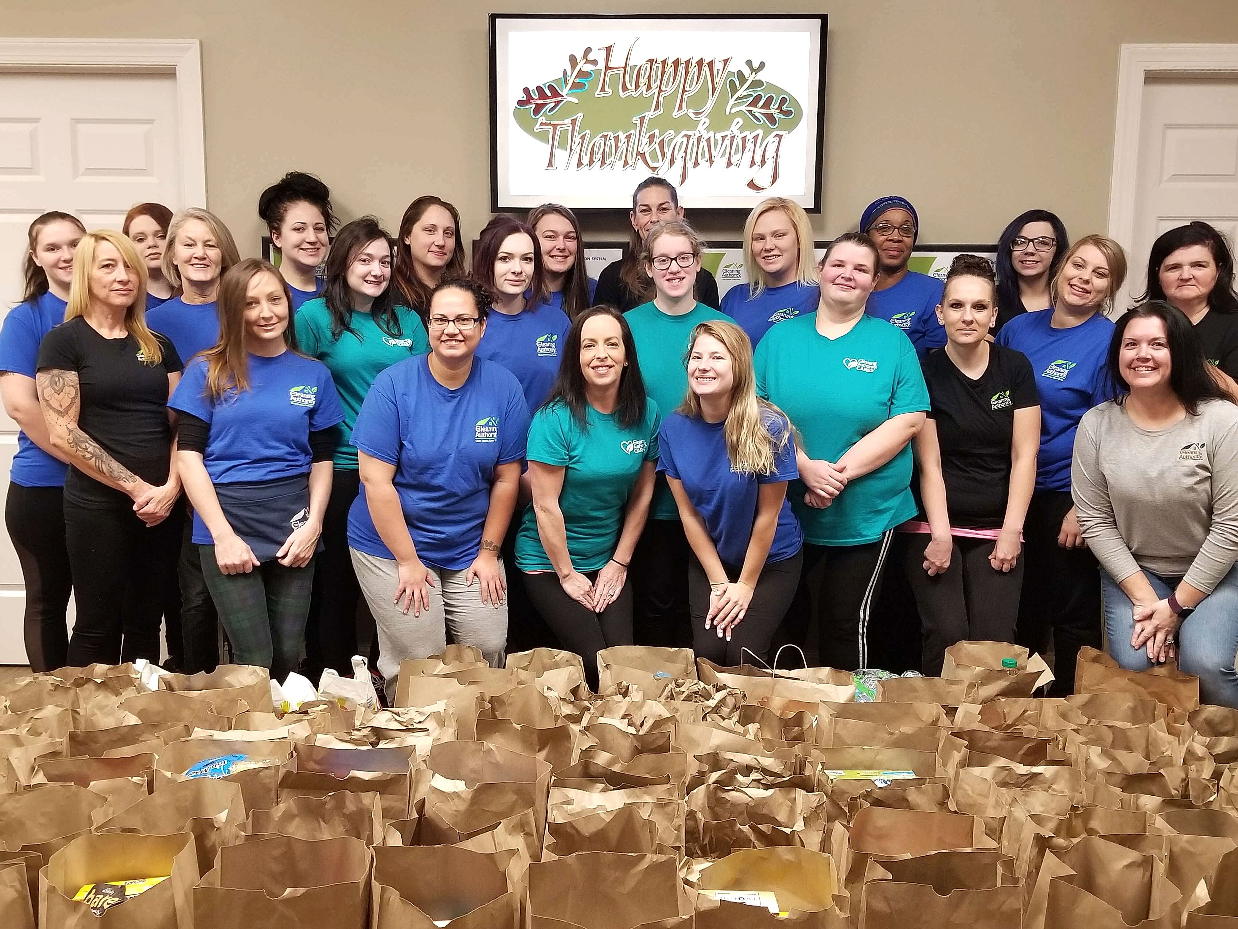 The TCA Broadview Heights team poses with the food donations collected for local charities.