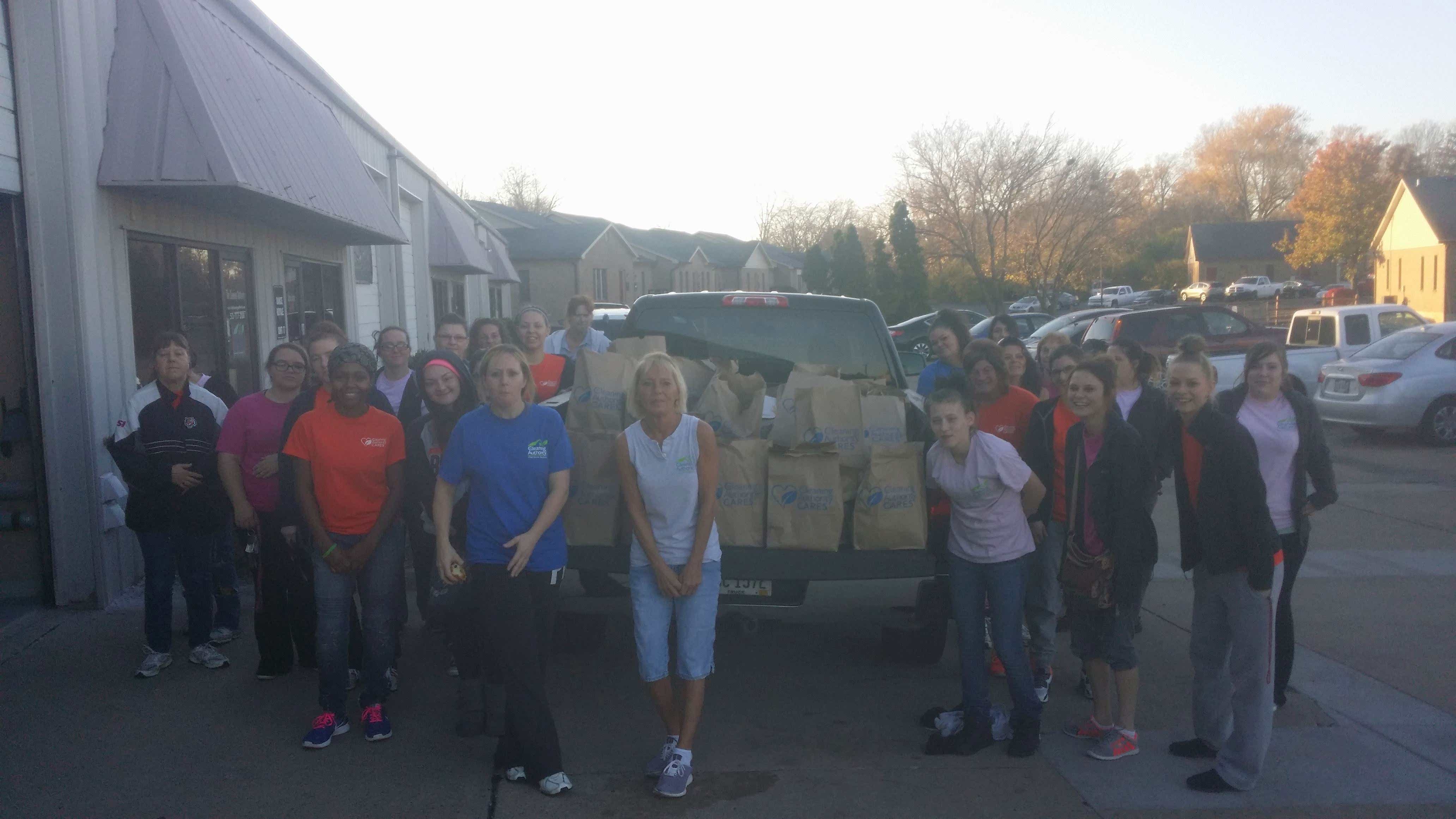 The TCA West Chester team poses with donations collected for the Shared Harvest Foodbank.